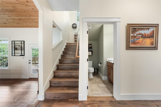 3205 River Place Dr Unit B, Belton, TX 76513 - stairs featuring wood-type flooring, baseboards, and wood ceiling