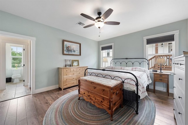 3205 River Place Dr Unit B, Belton, TX 76513 - bedroom with light wood-type flooring, baseboards, ensuite bathroom, and ceiling fan