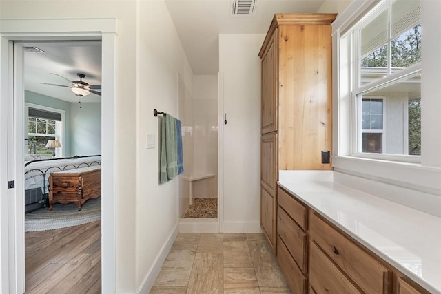 3205 River Place Dr Unit B, Belton, TX 76513 - ensuite bathroom with walk in shower, a ceiling fan, baseboards, and vanity