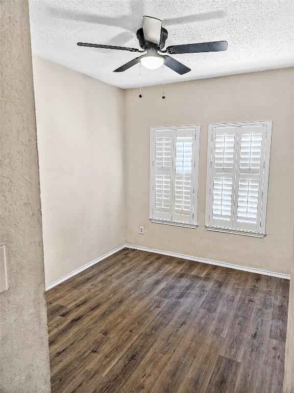 2706 Salado St Unit 205, Austin, TX 78705 - unfurnished room featuring wood finished floors, a textured ceiling, a ceiling fan, and baseboards