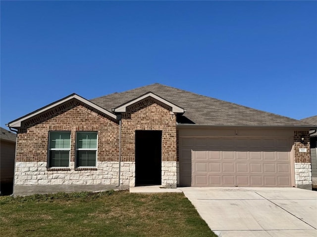 322 Harvest Creek Dr, Kyle, TX 78640 - ranch-style home featuring driveway, a garage, brick siding, stone siding, and a shingled roof