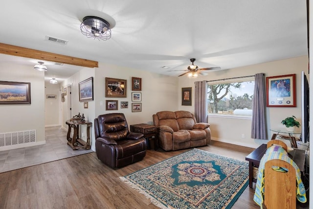 2340 E State Highway 71, Llano, TX 78643 - living area featuring baseboards, a ceiling fan, and wood finished floors