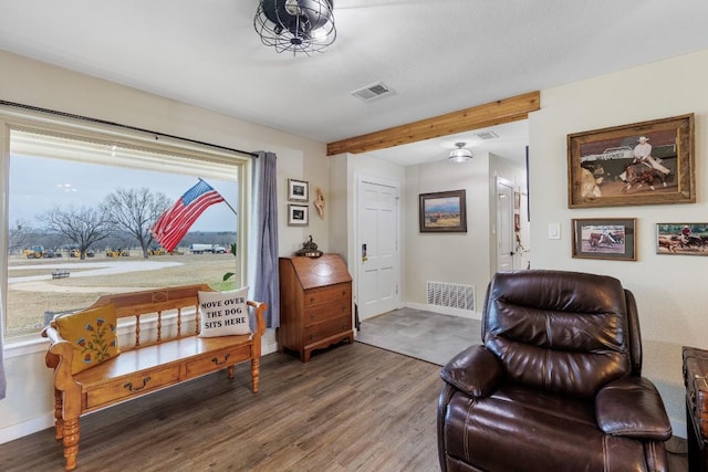 2340 E State Highway 71, Llano, TX 78643 - living area with baseboards, wood finished floors, and beam ceiling