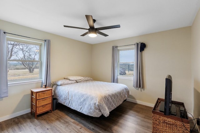 2340 E State Highway 71, Llano, TX 78643 - bedroom featuring wood finished floors, baseboards, and a ceiling fan