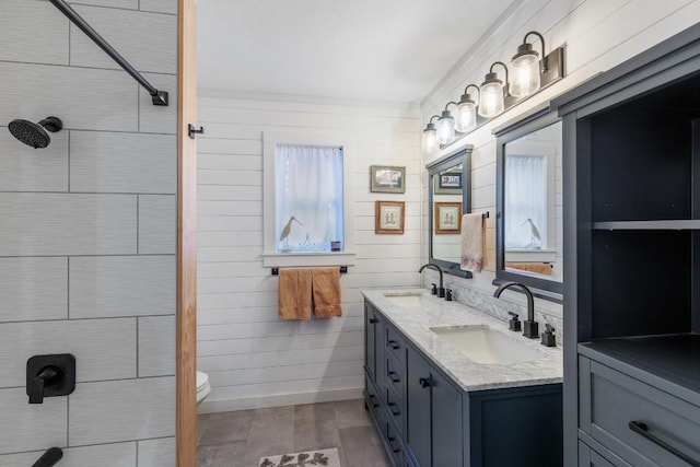 2340 E State Highway 71, Llano, TX 78643 - bathroom with double vanity, toilet, and a tile shower