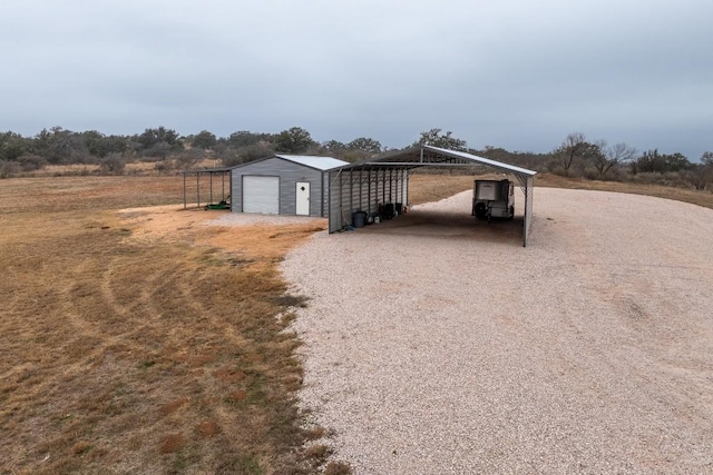 2340 E State Highway 71, Llano, TX 78643 - view of outdoor structure with driveway and a carport