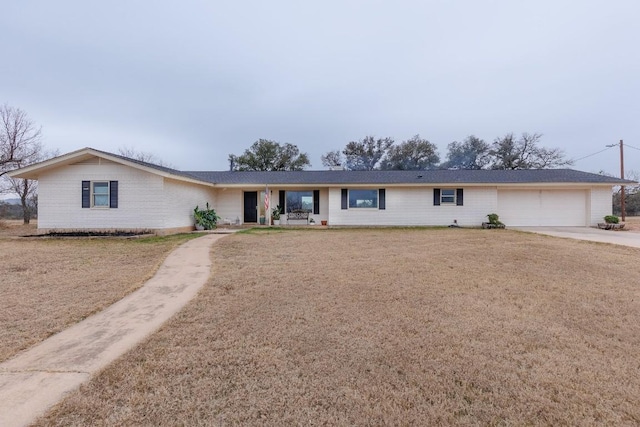 2340 E State Highway 71, Llano, TX 78643 - single story home featuring concrete driveway and an attached garage