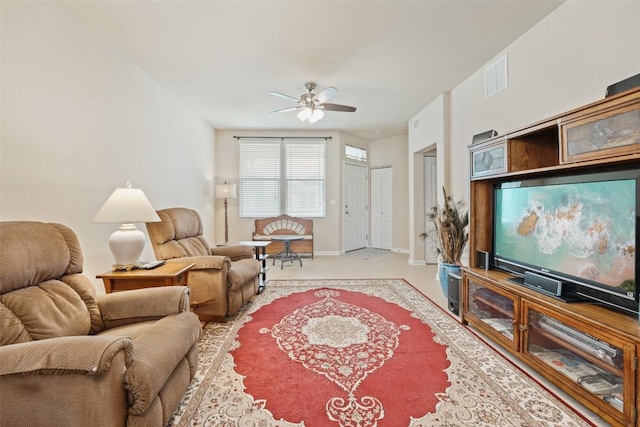 1261 Nevarez, Kyle, TX 78640 - living area with ceiling fan, light colored carpet, and baseboards