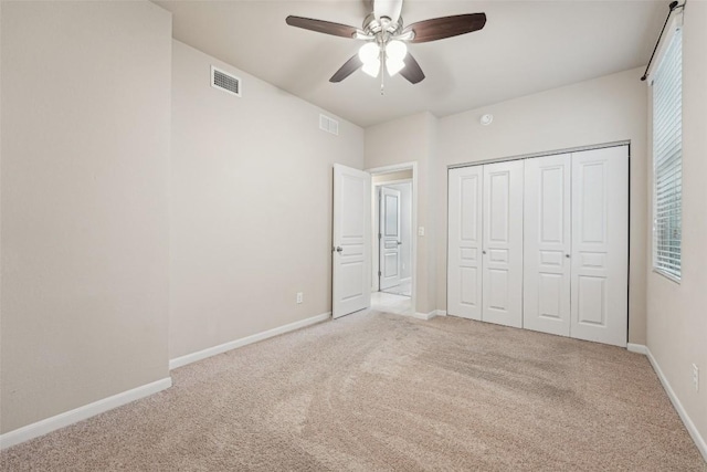 1261 Nevarez, Kyle, TX 78640 - unfurnished bedroom with carpet flooring, a closet, and ceiling fan
