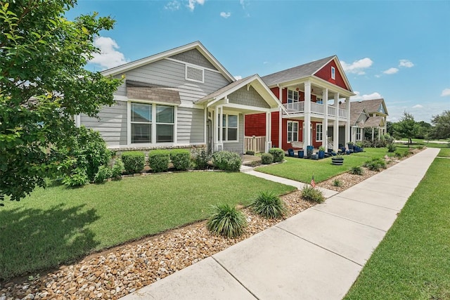 1261 Nevarez, Kyle, TX 78640 - view of front facade with a porch, a balcony, and a front yard