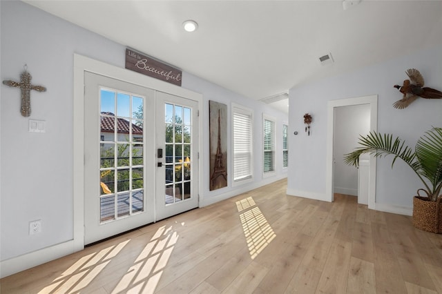 120 Acapulco Dr, Lakeway, TX 78734 - doorway to outside featuring french doors, wood finished floors, and baseboards