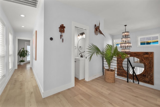 120 Acapulco Dr, Lakeway, TX 78734 - corridor with an upstairs landing, light wood-style floors, healthy amount of natural light, recessed lighting, and baseboards