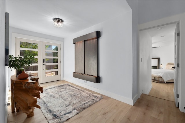 120 Acapulco Dr, Lakeway, TX 78734 - sitting room featuring french doors, wood-type flooring, and baseboards