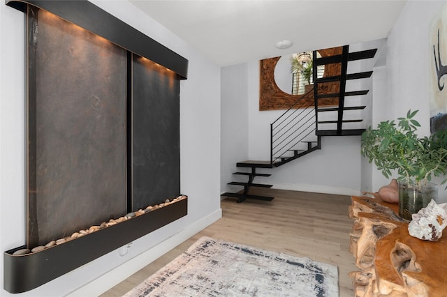 120 Acapulco Dr, Lakeway, TX 78734 - foyer entrance with stairs, baseboards, and wood finished floors