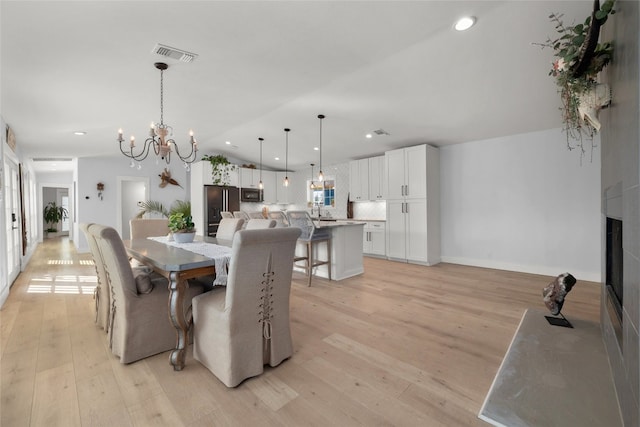120 Acapulco Dr, Lakeway, TX 78734 - dining area with a chandelier, light wood-type flooring, recessed lighting, and baseboards