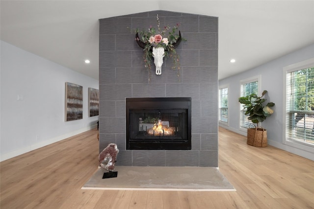 120 Acapulco Dr, Lakeway, TX 78734 - detailed view of wood finished floors, a tiled fireplace, baseboards, and recessed lighting