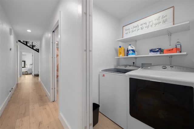 120 Acapulco Dr, Lakeway, TX 78734 - washroom featuring washer and clothes dryer, light wood-style flooring, recessed lighting, and baseboards