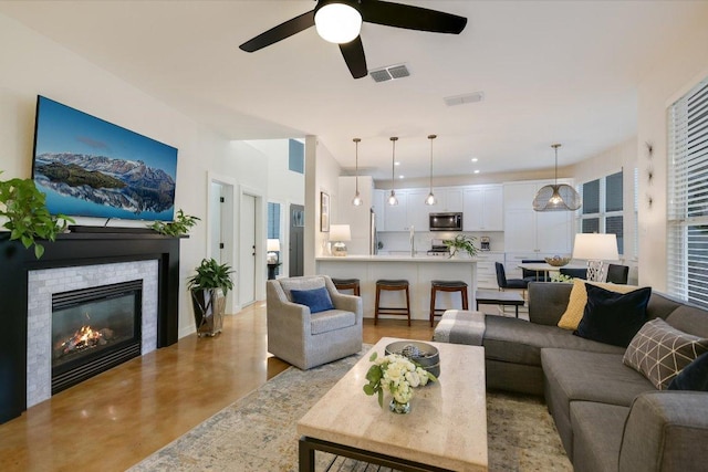 2114 Goodrich Ave Unit 3, Austin, TX 78704 - living area with a ceiling fan and a glass covered fireplace