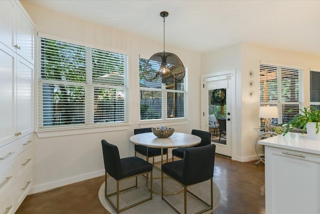 2114 Goodrich Ave Unit 3, Austin, TX 78704 - dining area with baseboards, finished concrete flooring, and plenty of natural light