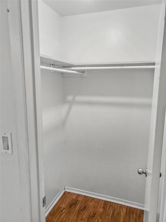 106 E 30th St Unit 305, Austin, TX 78705 - walk in closet with dark wood-style floors