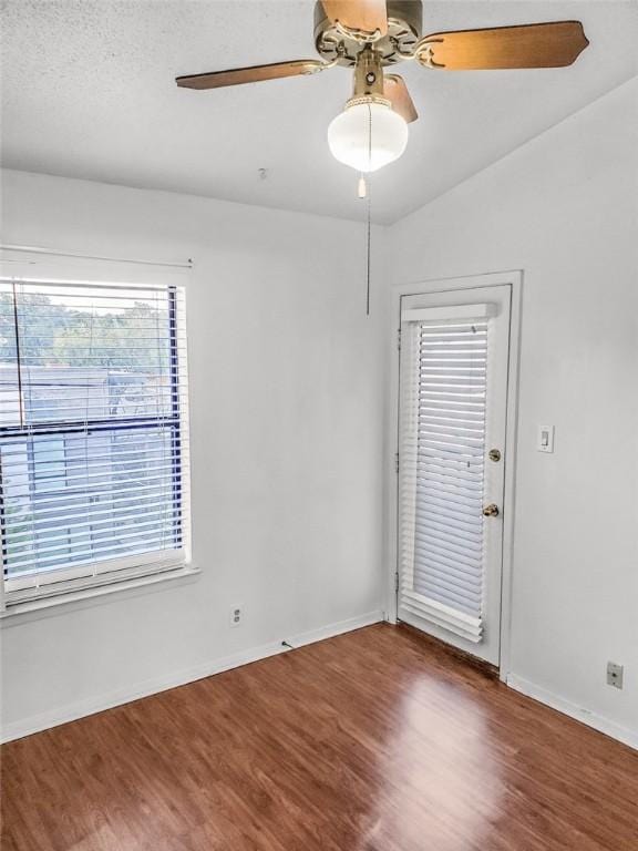 106 E 30th St Unit 305, Austin, TX 78705 - empty room with a ceiling fan, wood finished floors, and baseboards