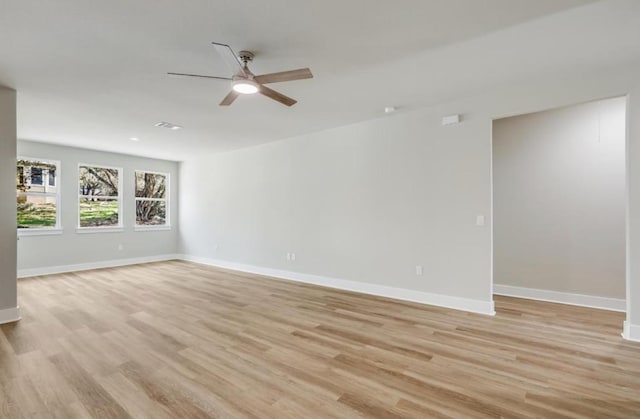 21710 Patton Dr, Lago Vista, TX 78645 - empty room featuring ceiling fan, light wood-style floors, and baseboards