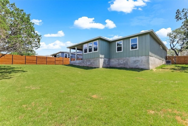 21710 Patton Dr, Lago Vista, TX 78645 - rear view of property featuring board and batten siding and cooling unit