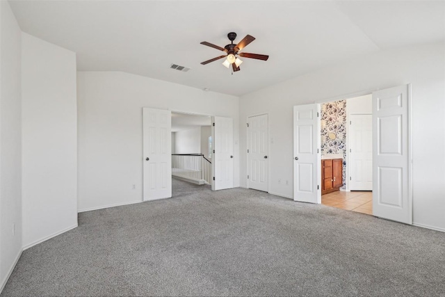 14009 Rountree Ranch Ln, Austin, TX 78717 - unfurnished bedroom featuring light carpet, ensuite bathroom, baseboards, and a ceiling fan
