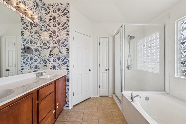 14009 Rountree Ranch Ln, Austin, TX 78717 - bathroom featuring wallpapered walls, a shower stall, a garden tub, tile patterned flooring, and double vanity
