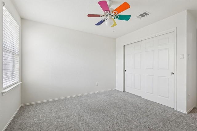 14009 Rountree Ranch Ln, Austin, TX 78717 - unfurnished bedroom featuring carpet flooring, multiple windows, and a closet