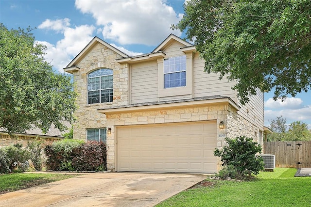 14009 Rountree Ranch Ln, Austin, TX 78717 - traditional home with stone siding, a garage, central AC, and concrete driveway