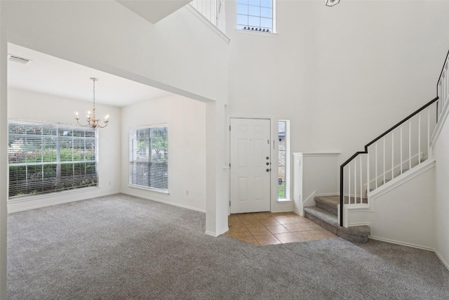 14009 Rountree Ranch Ln, Austin, TX 78717 - entrance foyer featuring carpet, plenty of natural light, a chandelier, stairway, and a high ceiling