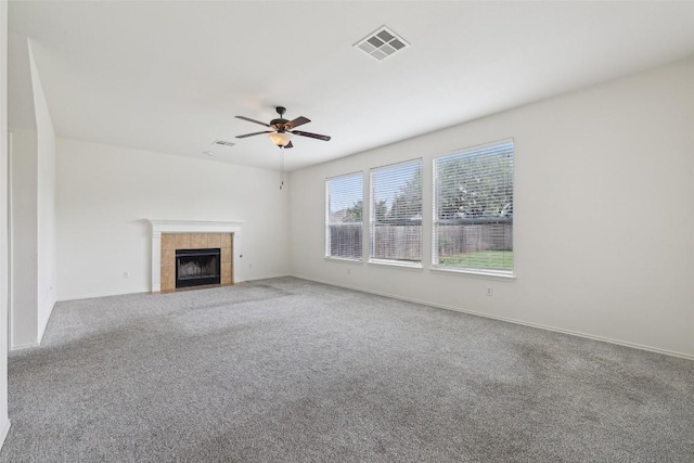 14009 Rountree Ranch Ln, Austin, TX 78717 - unfurnished living room with carpet floors, a ceiling fan, a tiled fireplace, and baseboards