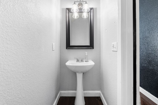 1600 Serenity Springs Cv, Cedar Park, TX 78613 - bathroom with baseboards, a textured wall, and wood finished floors