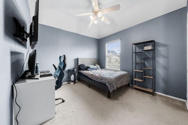 1600 Serenity Springs Cv, Cedar Park, TX 78613 - bedroom featuring an office area, vaulted ceiling, baseboards, light colored carpet, and a ceiling fan
