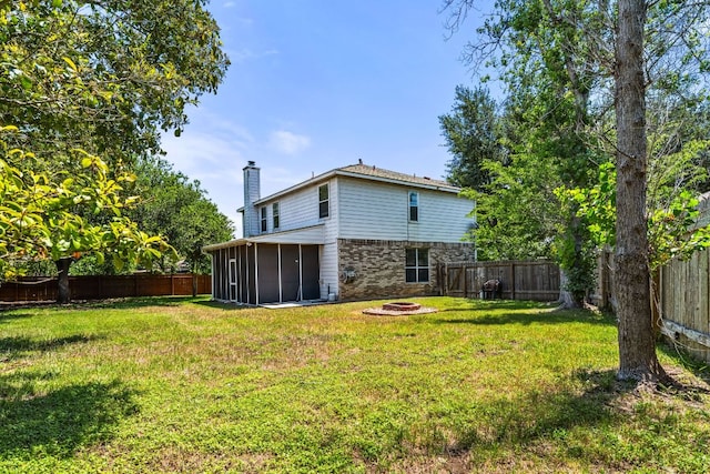 1600 Serenity Springs Cv, Cedar Park, TX 78613 - view of yard featuring an outdoor fire pit and a sunroom