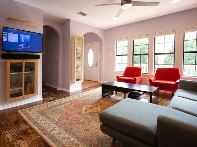 1808 Maple Ave, Austin, TX 78702 - living area featuring arched walkways, baseboards, a ceiling fan, recessed lighting, and wood finished floors