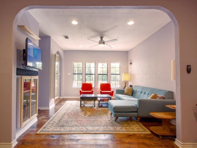 1808 Maple Ave, Austin, TX 78702 - living area featuring arched walkways, ceiling fan, wood finished floors, recessed lighting, and baseboards