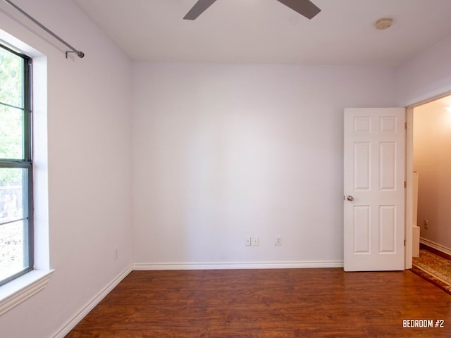 1808 Maple Ave, Austin, TX 78702 - unfurnished room featuring a ceiling fan, wood finished floors, a smoke detector, and baseboards