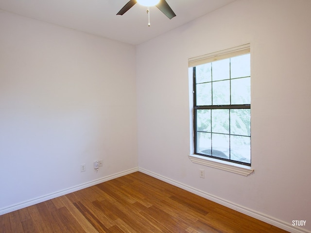 1808 Maple Ave, Austin, TX 78702 - spare room with wood finished floors, baseboards, and a ceiling fan