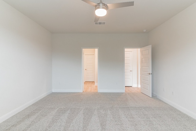 17900 Trieste Dr, Pflugerville, TX 78660 - unfurnished bedroom featuring light carpet, baseboards, and ceiling fan