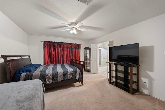 1207 Rolling Ridge Dr, Round Rock, TX 78665 - bedroom with carpet flooring, ensuite bath, ceiling fan, and a textured ceiling