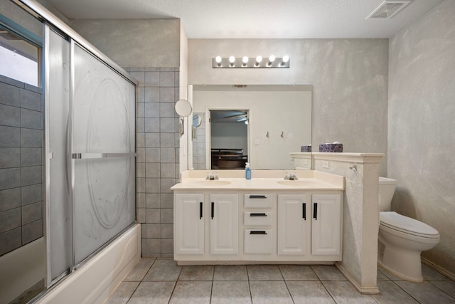1207 Rolling Ridge Dr, Round Rock, TX 78665 - bathroom featuring tile patterned floors, double vanity, and enclosed tub / shower combo