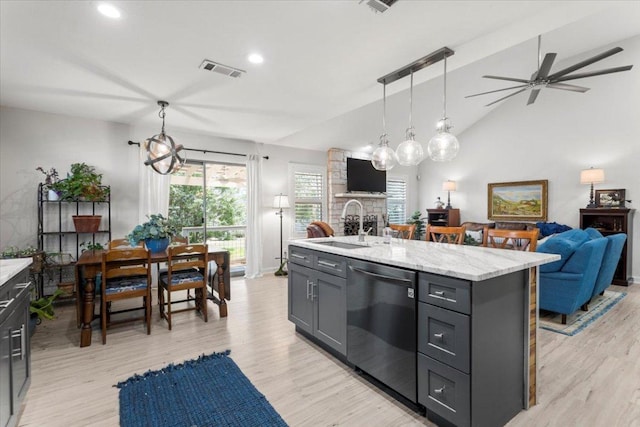 2003 Rain Water Dr, Austin, TX 78734 - kitchen with dishwasher, open floor plan, a fireplace, a ceiling fan, and recessed lighting