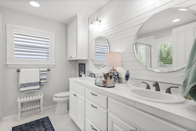 2003 Rain Water Dr, Austin, TX 78734 - bathroom with double vanity, healthy amount of natural light, tile patterned floors, and a shower