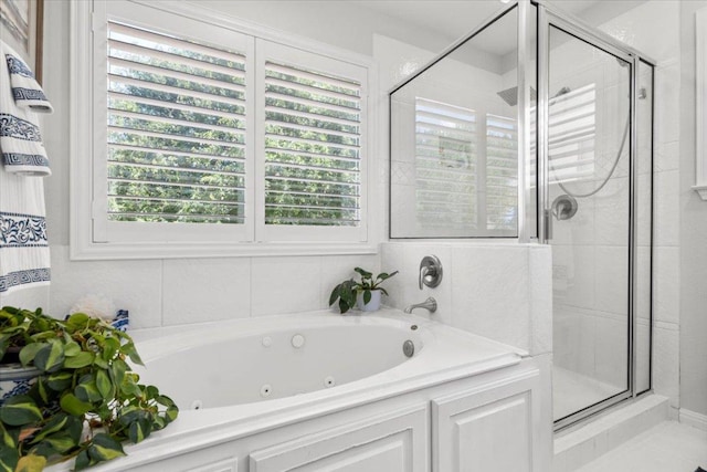 2003 Rain Water Dr, Austin, TX 78734 - full bath with a stall shower, a whirlpool tub, and healthy amount of natural light