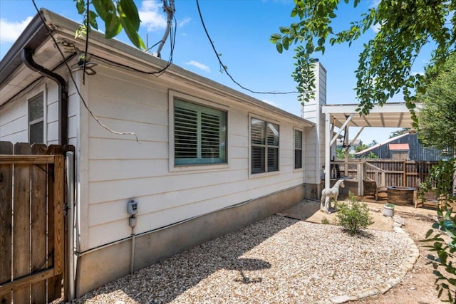 2003 Rain Water Dr, Austin, TX 78734 - view of property exterior featuring a chimney