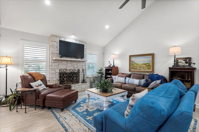 2003 Rain Water Dr, Austin, TX 78734 - living room featuring ceiling fan, wood finished floors, a fireplace, high vaulted ceiling, and recessed lighting
