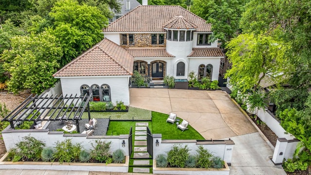 2621 Exposition Blvd, Austin, TX 78703 - mediterranean / spanish home featuring a tiled roof and stucco siding