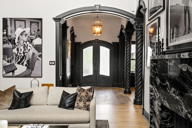 2621 Exposition Blvd, Austin, TX 78703 - entryway with arched walkways, wood finished floors, french doors, and ornate columns